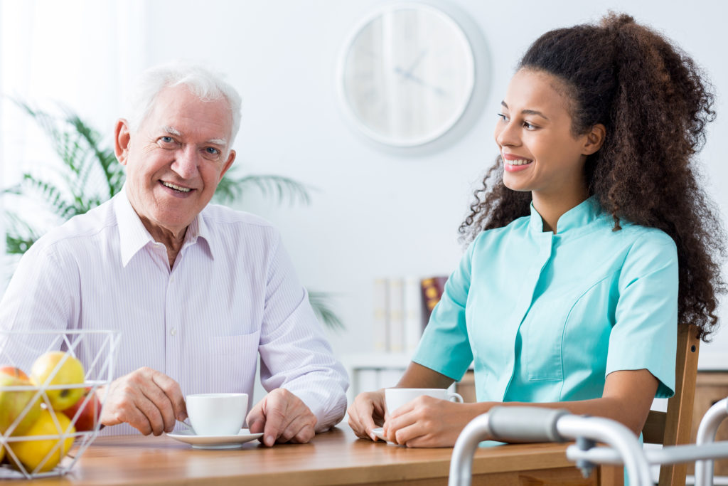 Positive Carer And Retired Man Image of positive afroamerican carer and retired man